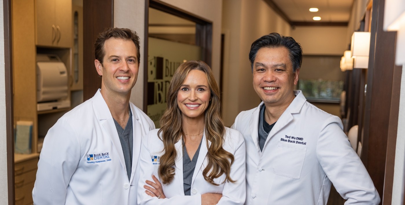 Three smiling dentists at Blue Back Dental