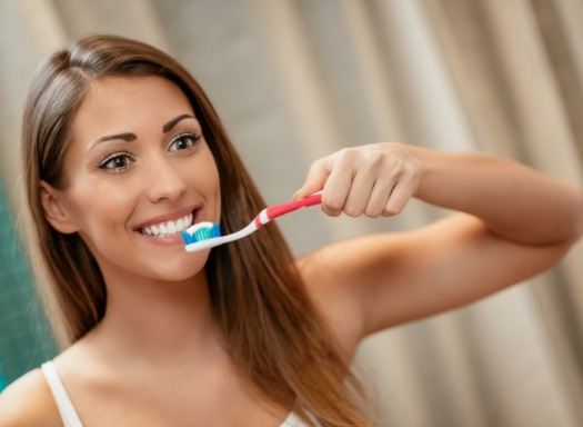 Woman brushing her teeth