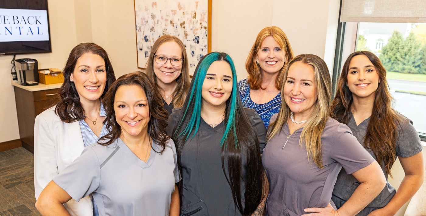 Several smiling team members at Blue Back Dental