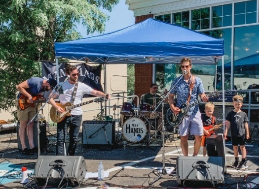 Doctor Tim performing in a rock band