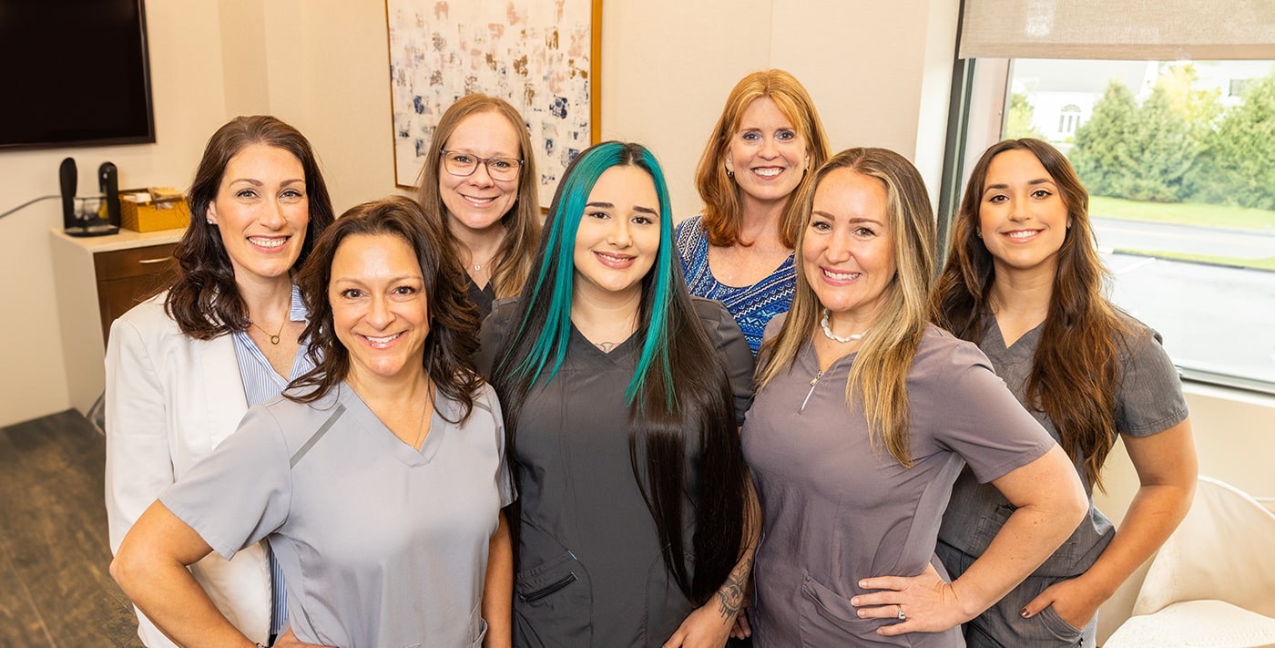 Group of smiling dental team members at Blue Back Dental in West Hartford and Avon