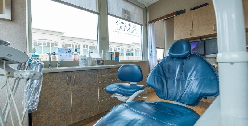 Front view of two blue dental chairs