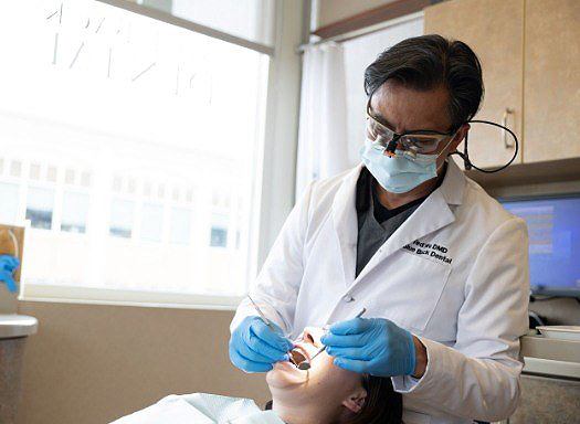 Dentist giving a patient a dental checkup