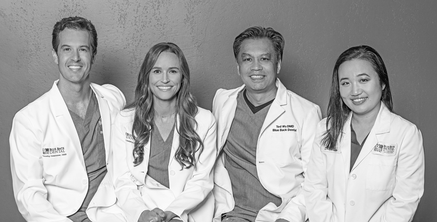 Four smiling dentists at Blue Back Dental