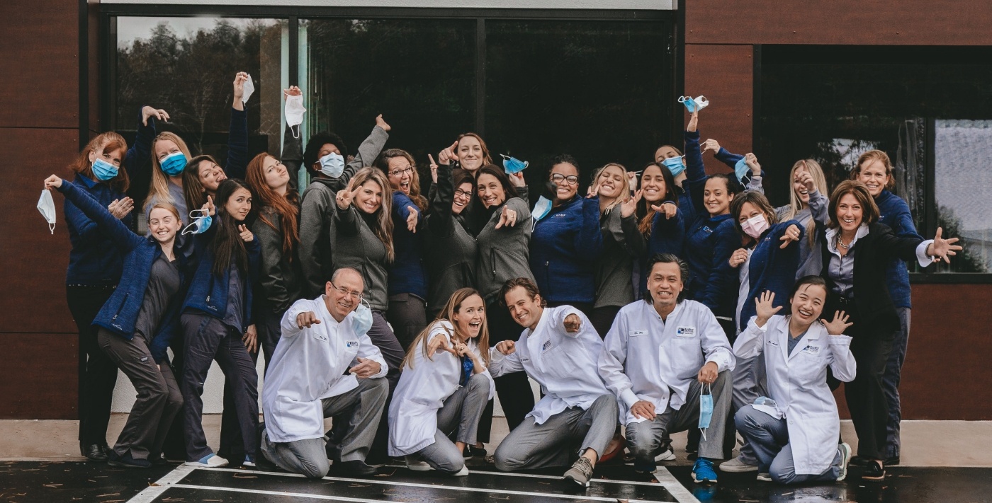 Large group photo of the dentists and team members at Blue Back Dental