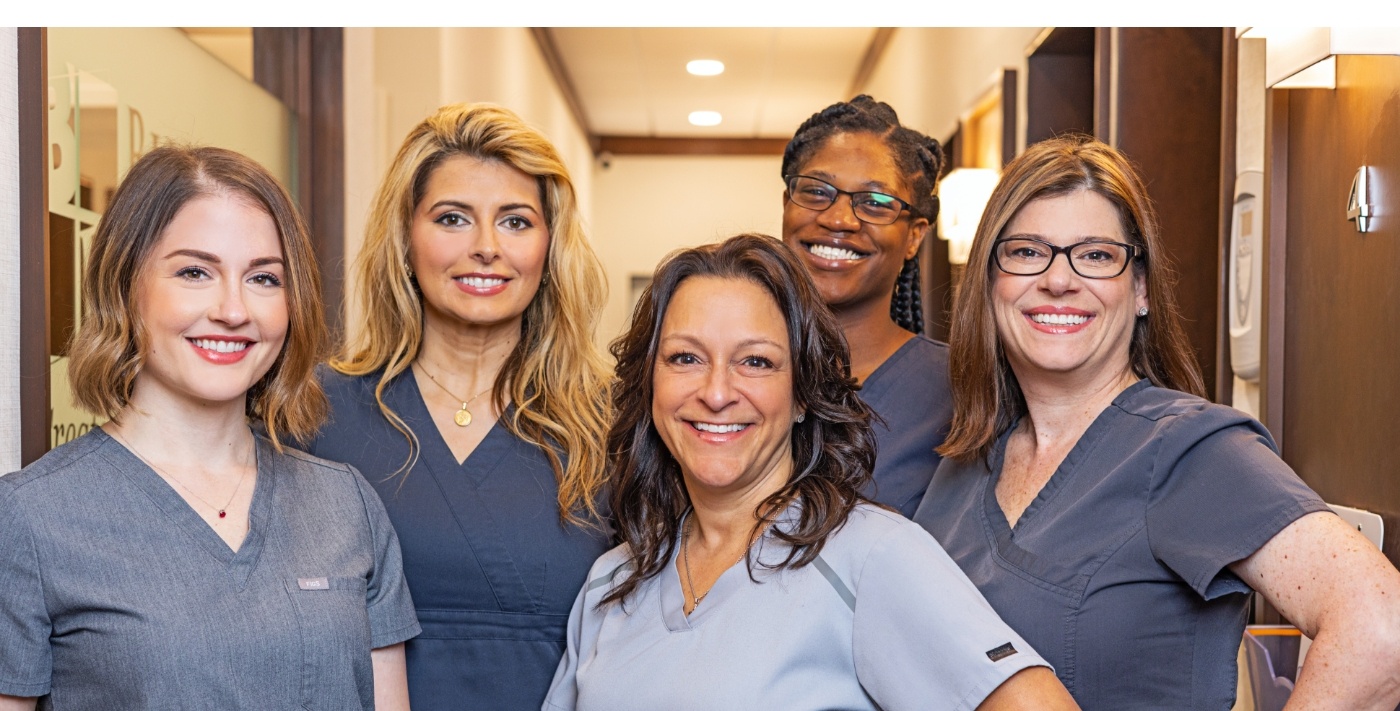 Group of smiling Blue Back Dental team members