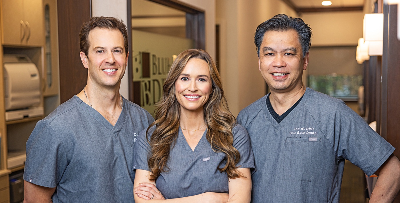 Three smiling dentists at Blue Back Dental