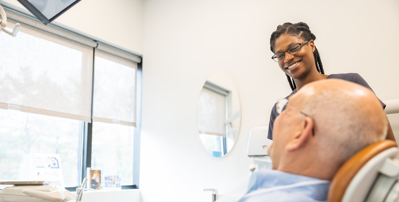 Dental patient smiling after sleep apnea treatment